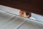 Wooden bunk bed in a bedroom for wooden versus metal bunk bed guide